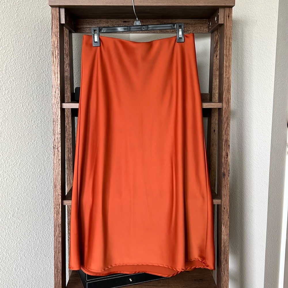 Bright orange silky skirt
